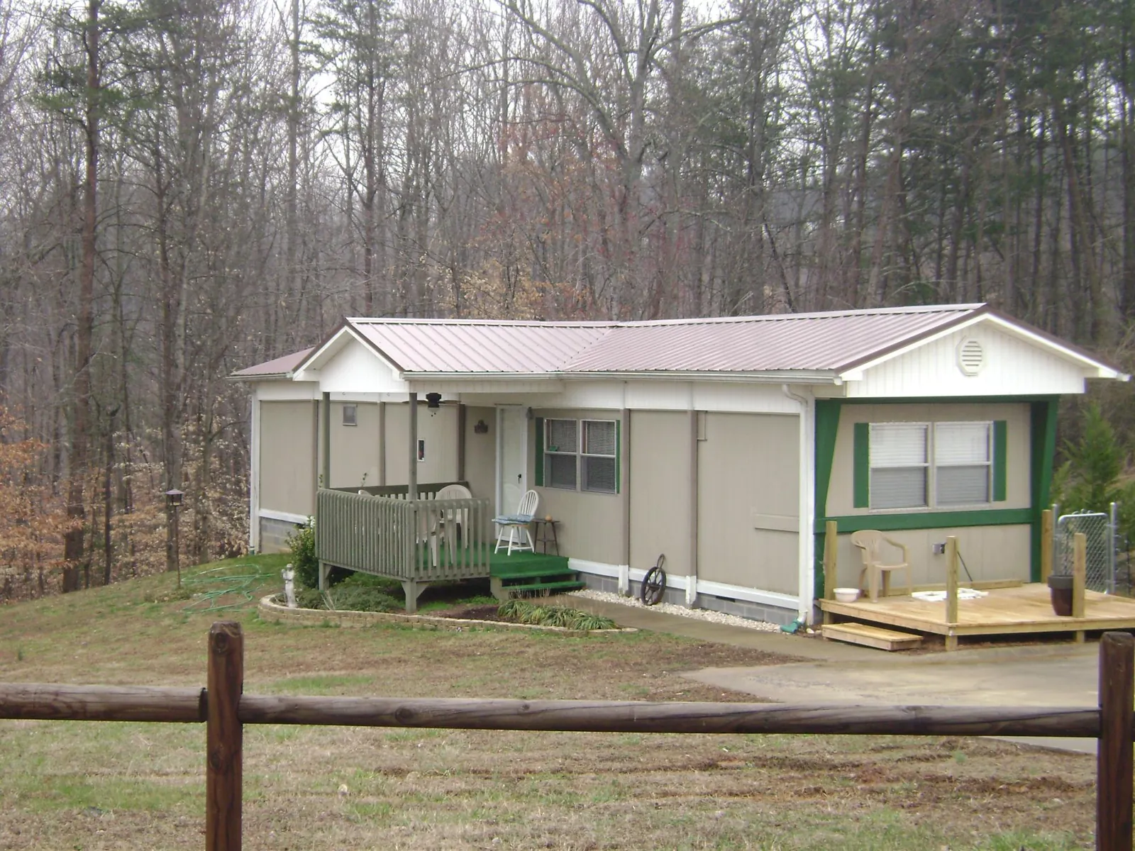 Mauve metal roof on a manufactured home with a new front deck in South Tamworth